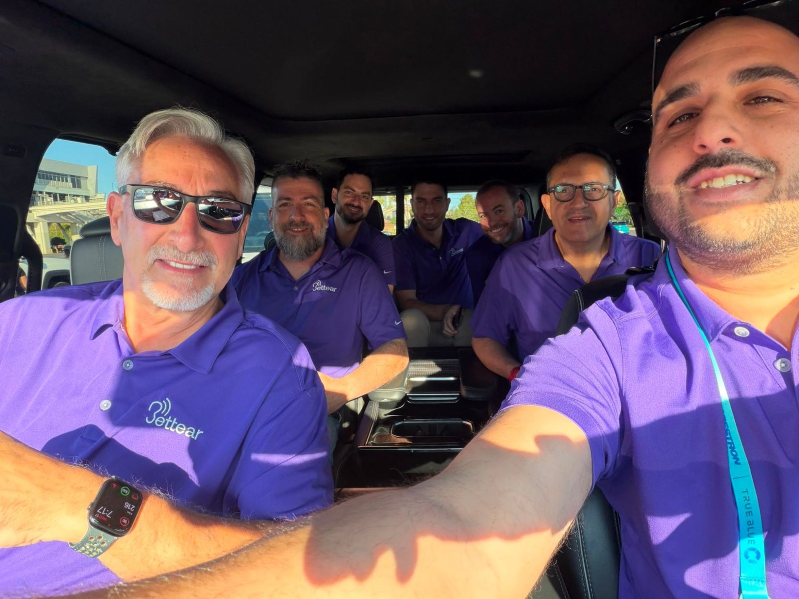 The team on the road in Bettear shirts