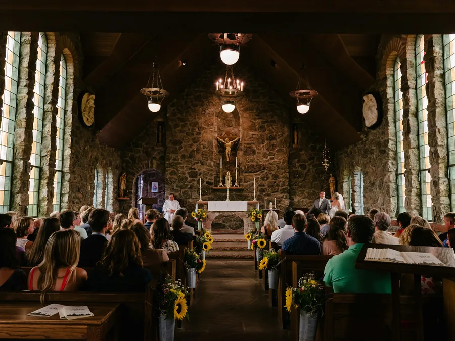 A congregation during a service in a stone church