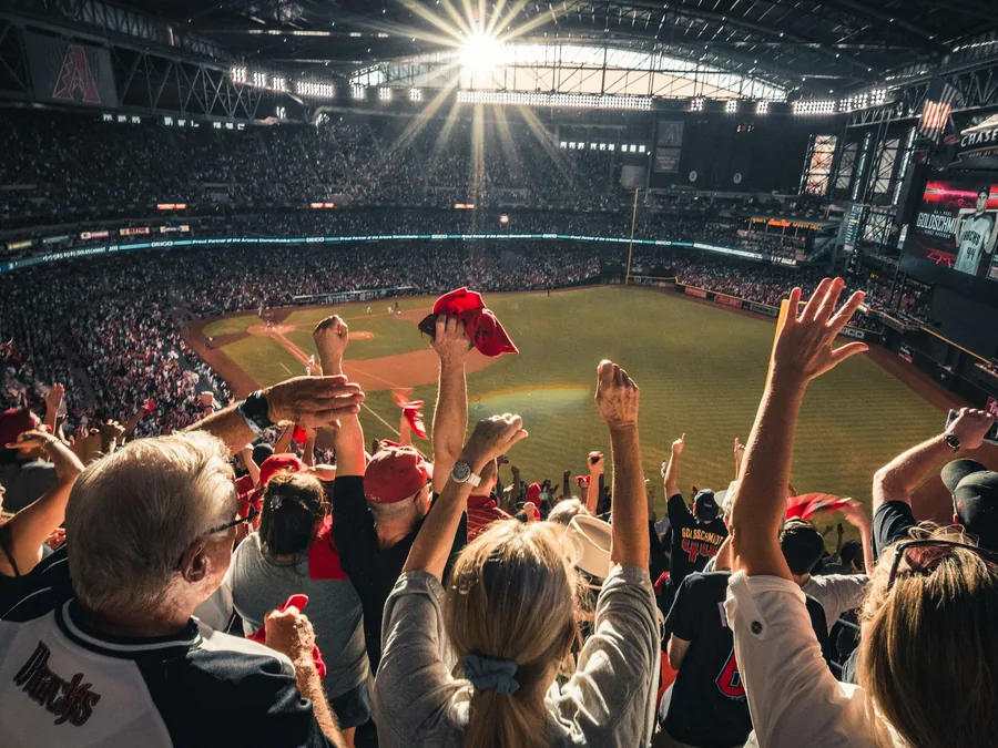 Fans cheering in a full stadium